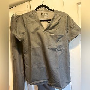 Grey graphite color figs scrub top in technical collection